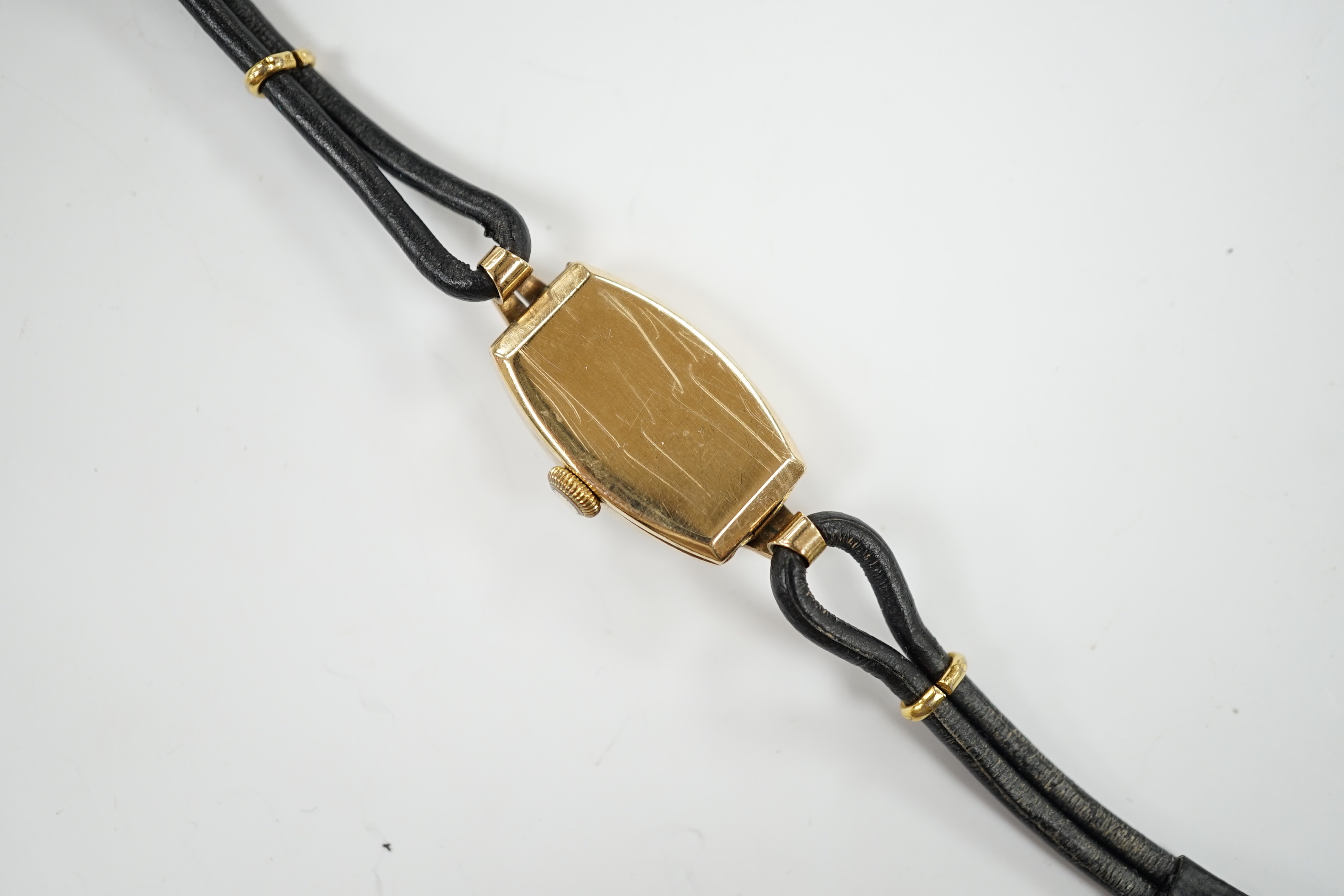 A lady’s 9ct gold Omega manual wind wrist watch, on a twin fabric strap.